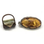 A Lea Stein handbag brooch and silver amber pendant brooch