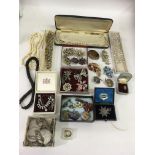 A collection of vintage costume jewellery including brooches