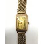A gents vintage Rotary 9ct gold cased wristwatch, mounted on a 9ct gold Milanese mesh style strap.