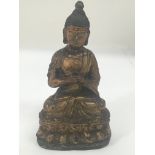 A small bronze figure of Buddha.Approx 18cm