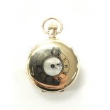 A gold plated half hunter Waltham traveler pocket watch. Some damage to the case which is made by