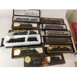 Included are 7 oo gauge locomotives and 4 boxed coaches.