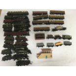 Included are 12 OO gauge locomotives and a large assortment of rolling stock.