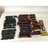 Included are 10 OO gauge locomotives and a number of boxed coaches and other rolling stock as well