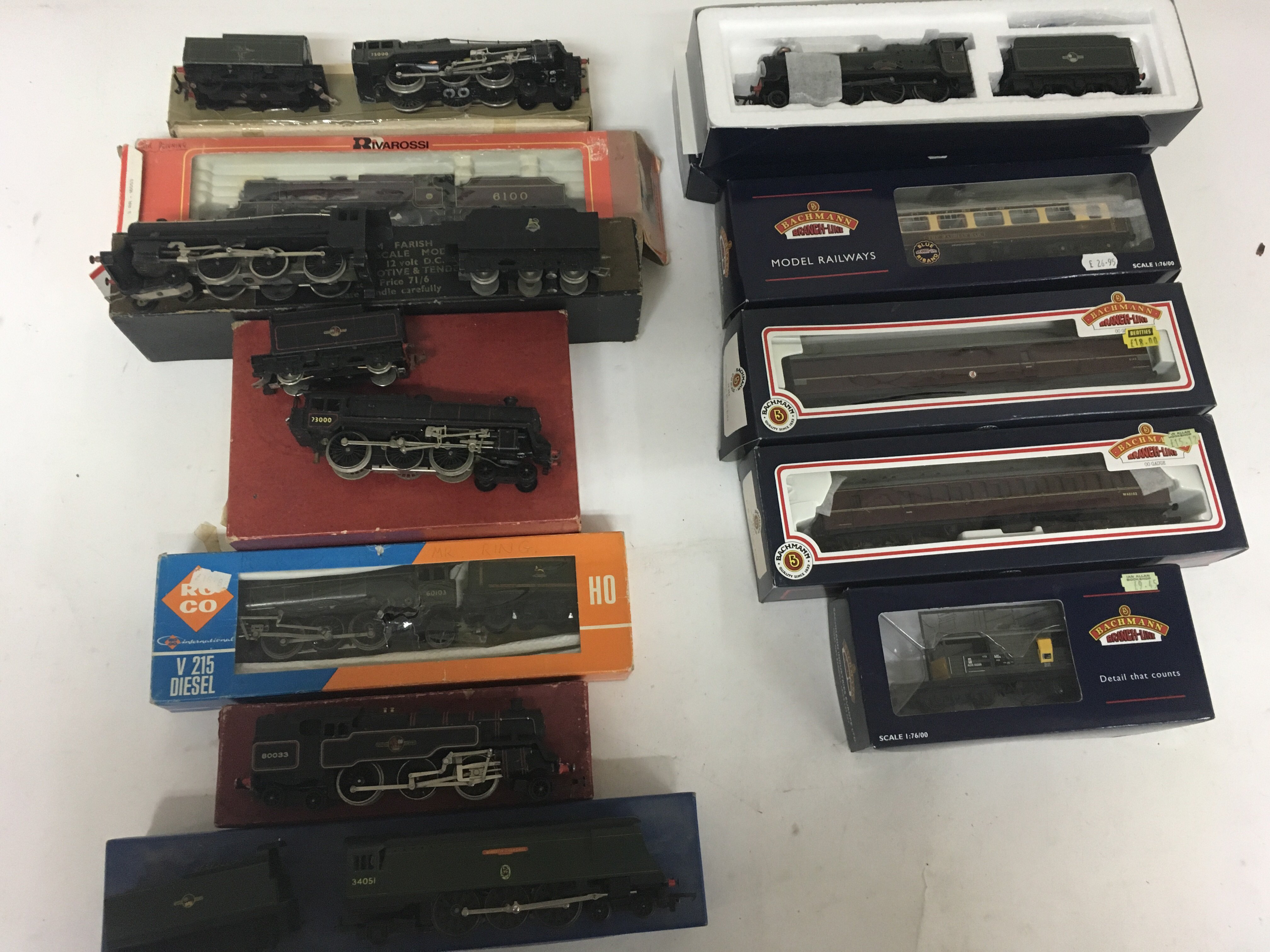 Included are 8 boxed locomotives including a Bachman locomotive with 3 boxed coaches and 1 wagon.