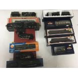 Included are 8 boxed locomotives including a Bachman locomotive with 3 boxed coaches and 1 wagon.