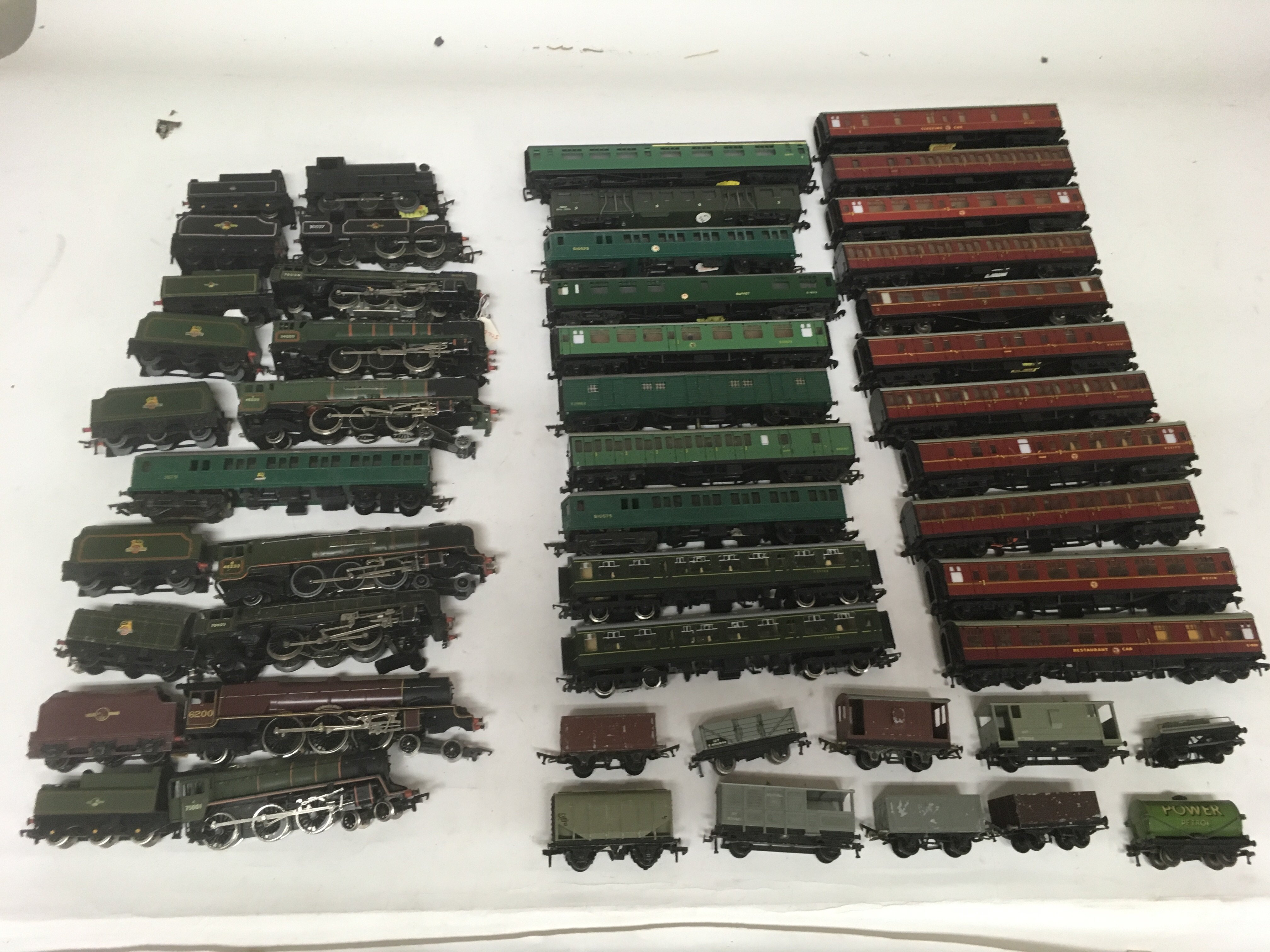 Included are 10 OO gauge locomotives, and a large number of coaches and other Rolling stock.