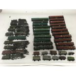 Included are 10 OO gauge locomotives, and a large number of coaches and other Rolling stock.