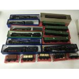 Included are 7 hornby o gauge locomotives, 5 boxed coaches and a number of other rolling stock.