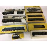 Included are 5 oo gauge locomotives, including 2 wren locomotives. Also included are 3 trix