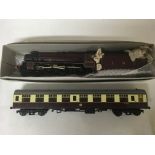 Included is an o Gauge Bahamas 5596 locomotive with tender and carriage.