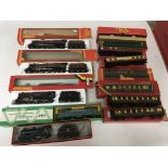 Included are 5 boxed hornby oo gauge locomotives and 7 boxed carriages.