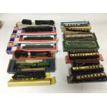 Included are 7 boxed oo gauge locomotives and 9 boxed carriages.