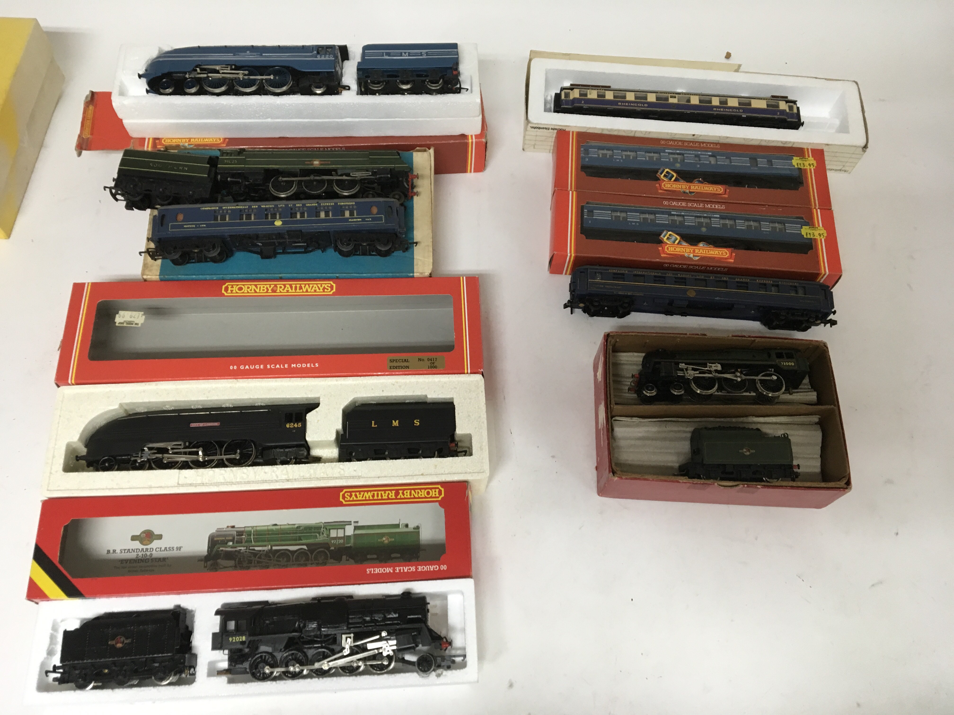 Included are 5 boxed hornby locomotives and 4 coaches.