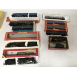 Included are 5 boxed hornby locomotives and 4 coaches.