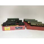 Included are 3 horny oo gauge locomotives boxed, and 4 boxed carriages.