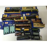 Included are 4 boxed hornby 3 rail locomotives. As well are 2 boxed carriages, a boxed building