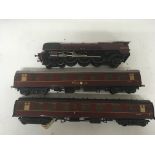 Included is an o Gauge Duchess of Sutherland locomotive with 2 carriages.