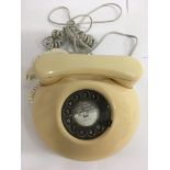 An vintage cream colour dial phone, converted