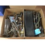 Three boxes and a wooden box containing medical equipment and surgeons implements.