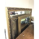 Three large gilt framed wall mirrors