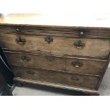 A mahogany chest of drawers the rectangular top above a brushing slide with three drawers under on