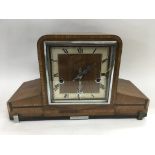 An Art Deco design mantle clock plus one others.