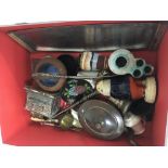 A box containing oddments including a silver handl