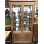 A Chinese hardwood display cabinet with nine glass