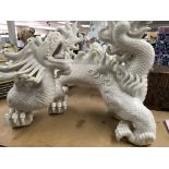 A pair of white glazed Chinese style dragons
