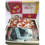 A boxed Japanese kimono and accessories.