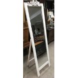 A full length, white painted freestanding mirror.Approx 50x170cm high