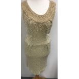 A vintage Norman Hartnell, heavy beadwork shift dress, labelled approx size 8.Sold with a