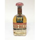 A bottle of Vintage Red Hill High Quality Whisky o