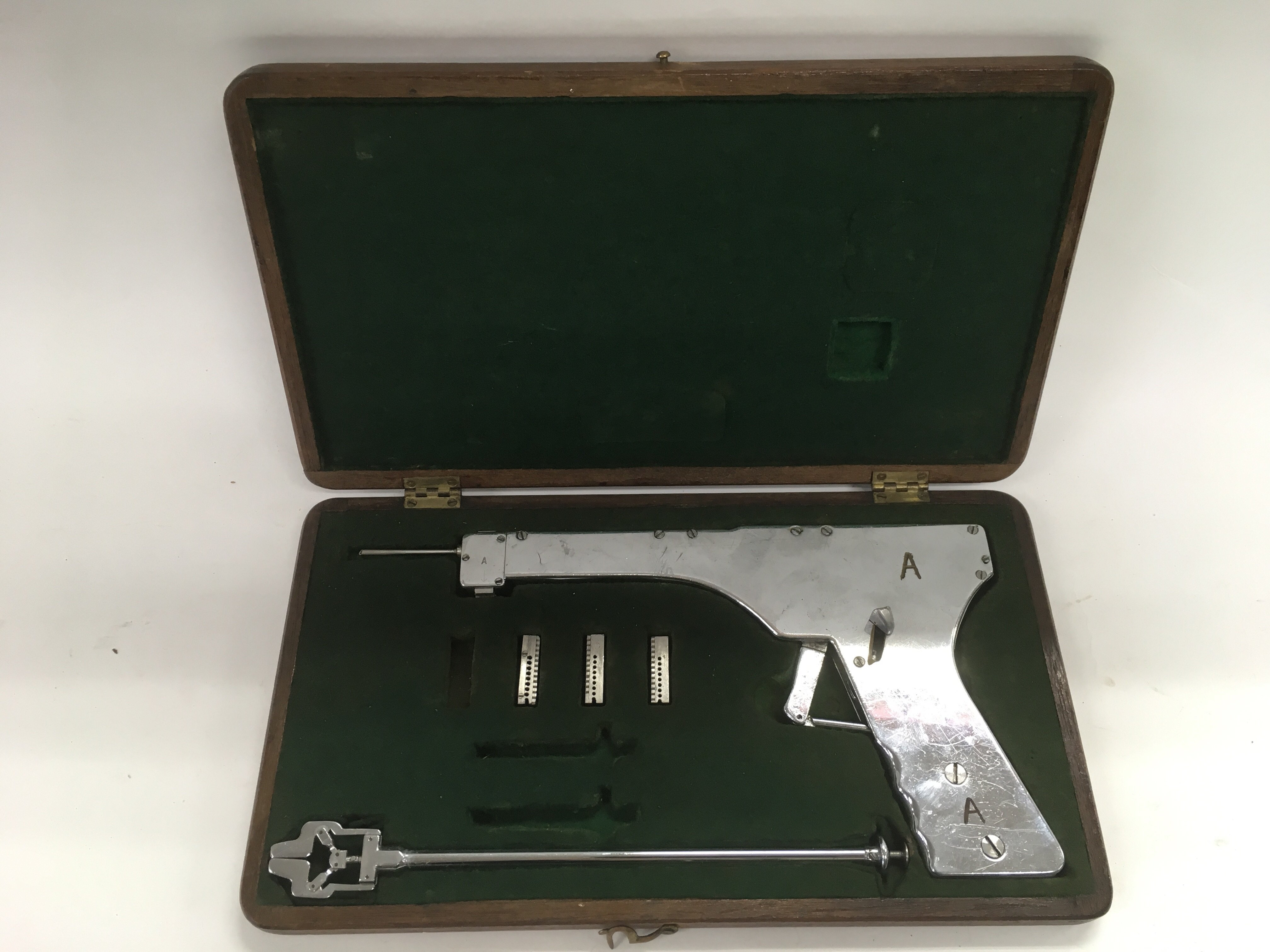 A vintage cased medical instrument, possibly a rad