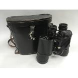 A cased pair of binoculars.