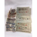 A collection of old English and German bank notes.