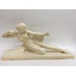 A large Art Deco style plaster figure of a stylise