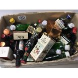 A box containing a quantity of miniature bottles o