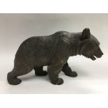 A carved black forest bear, approx height 17cm and