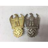 A pair of German WW2 Dr. Todt prize badges, one in