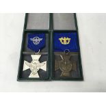 A pair of German WW2 police service medals in copy