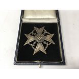 A German WW2 Spanish bronze cross in copy presenta