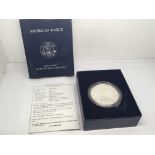 A 2008 Burnished Uncirculated one ounce Silver (9.99%) American Eagle Dollar. Designed by Adolph A