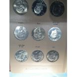 An Album containing Eisenhower Dollars 1971-1978 complete set. Designed by Frank Gasparro. “The