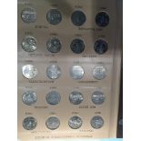 An Album containing Washington StateHood Commemorative Quarters. 1999-P to 2008-D 100 coins full set