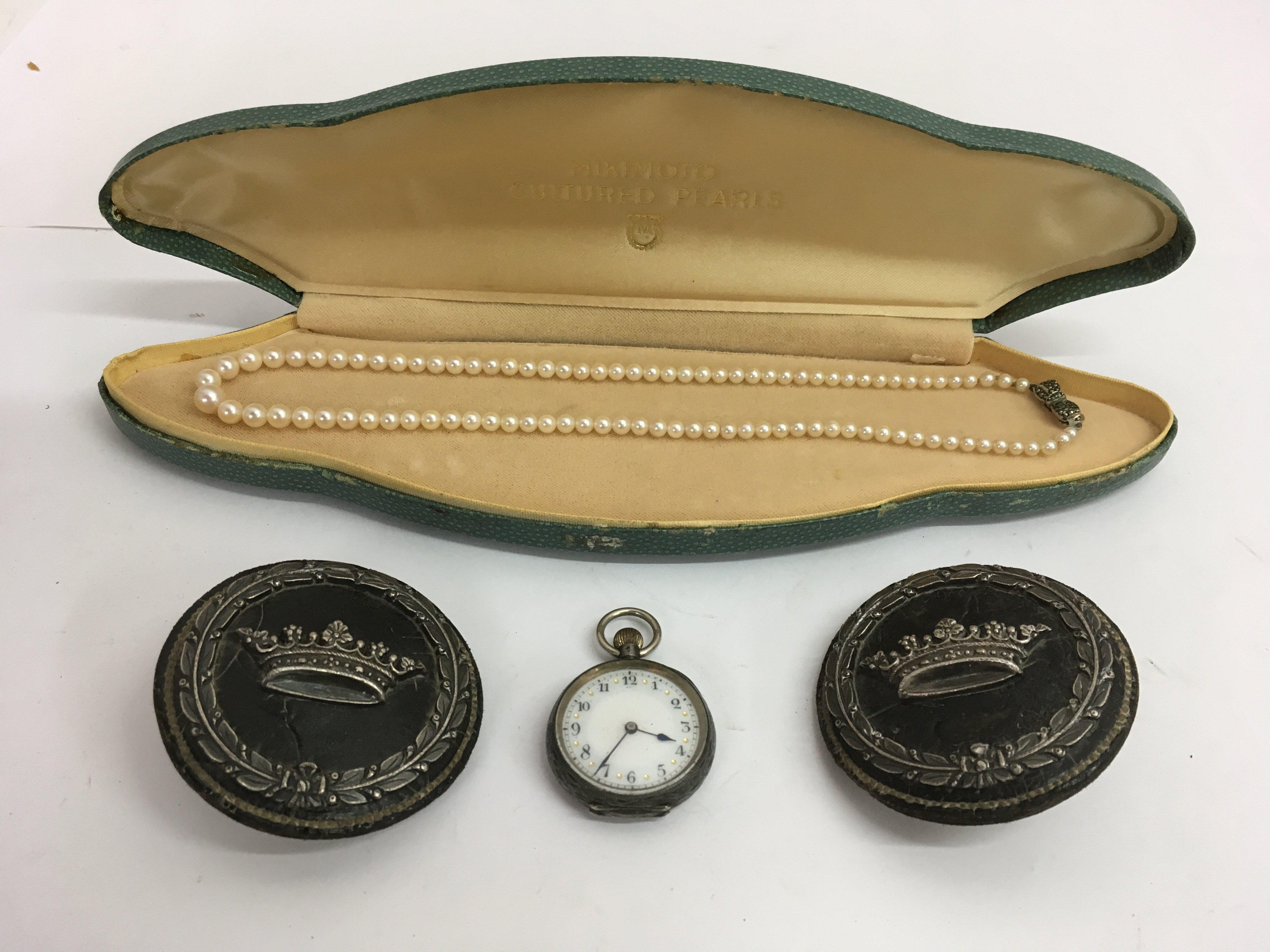 A lady's silver pocket watch, silver clasp pearl n