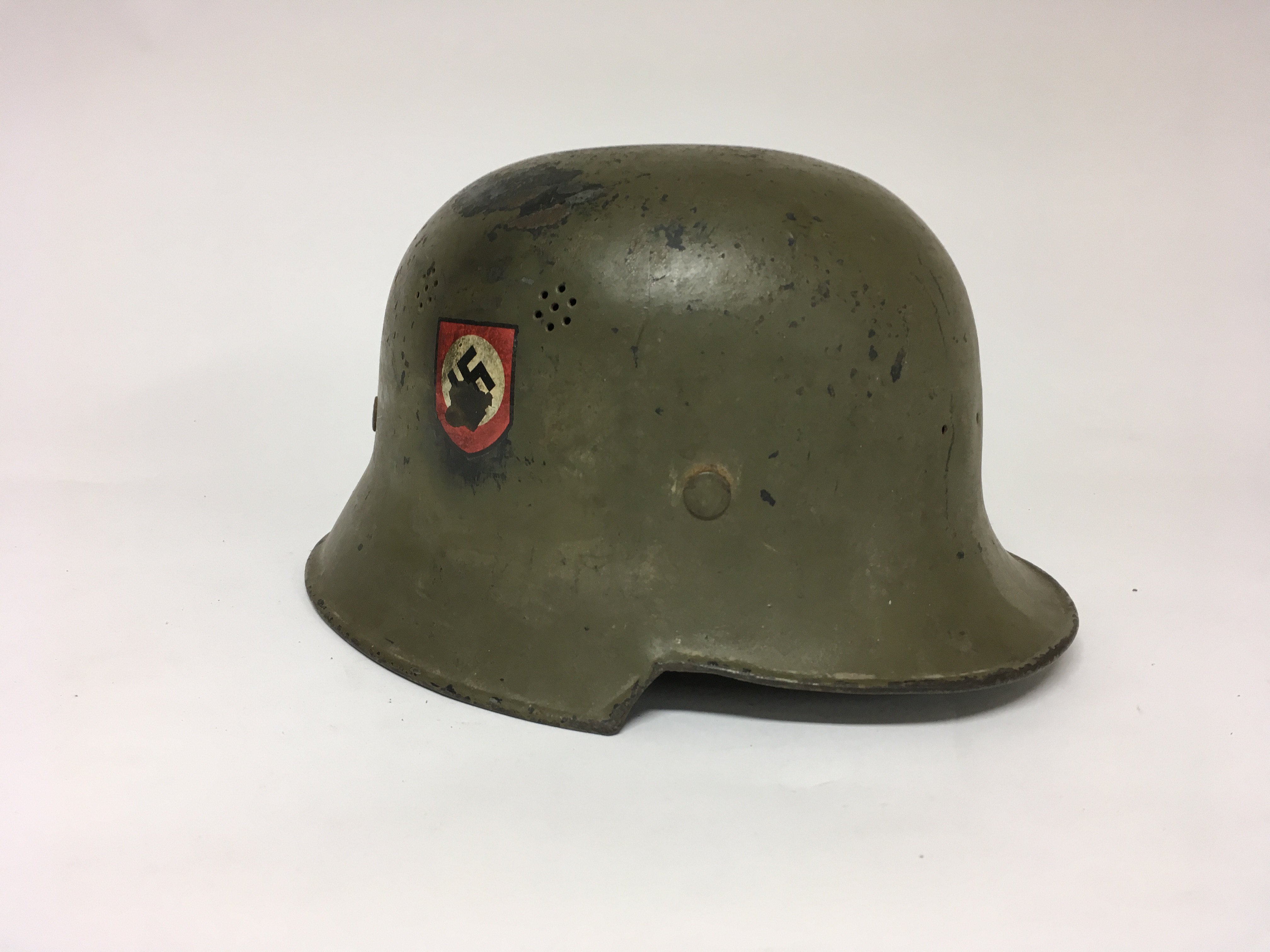 A German third reich WW2 helmet with insignias either side and headliner.