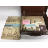 A small vintage suitcase of cigarette cards, postc