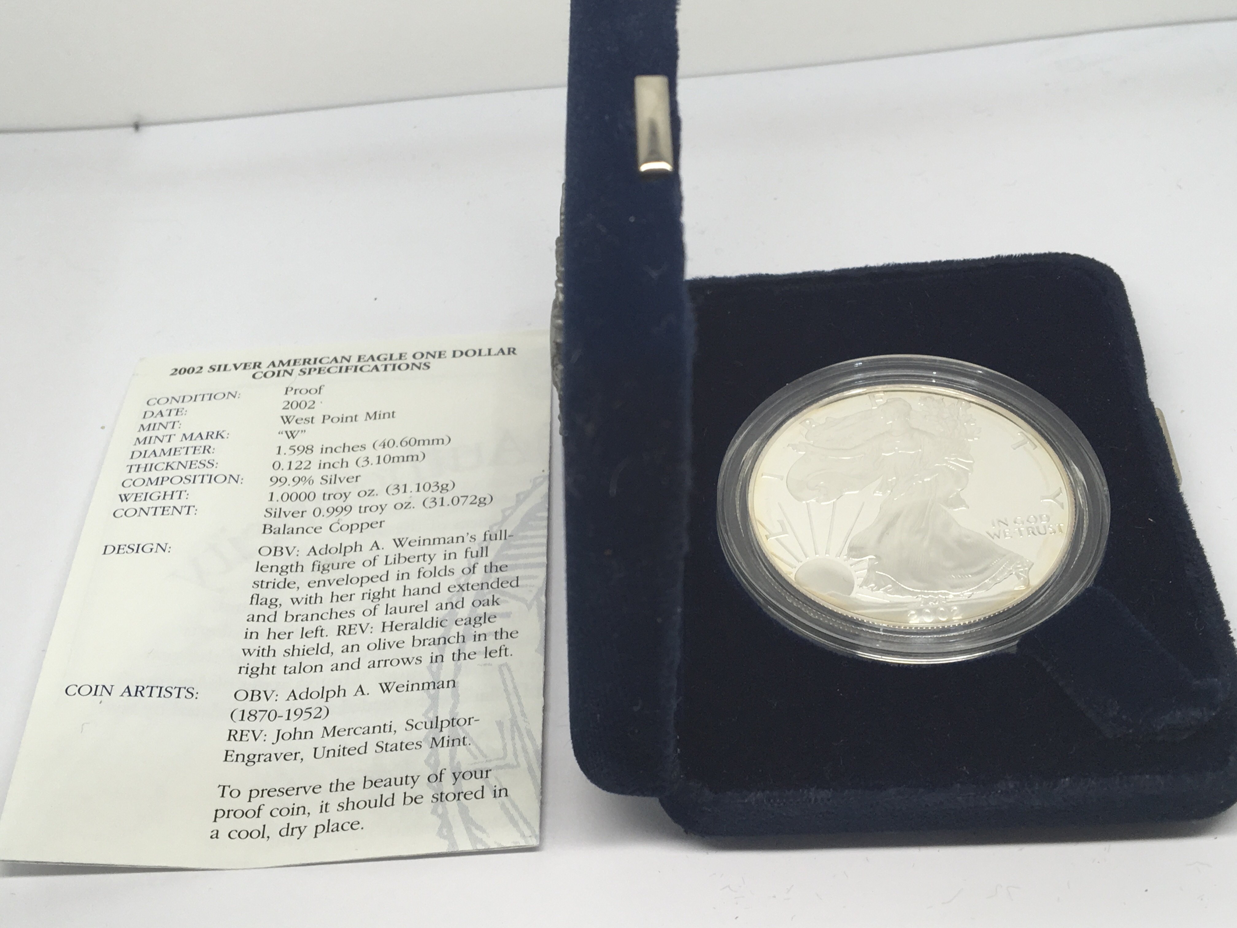 A Silver 2002 Proof American silver (9.99%) dollar